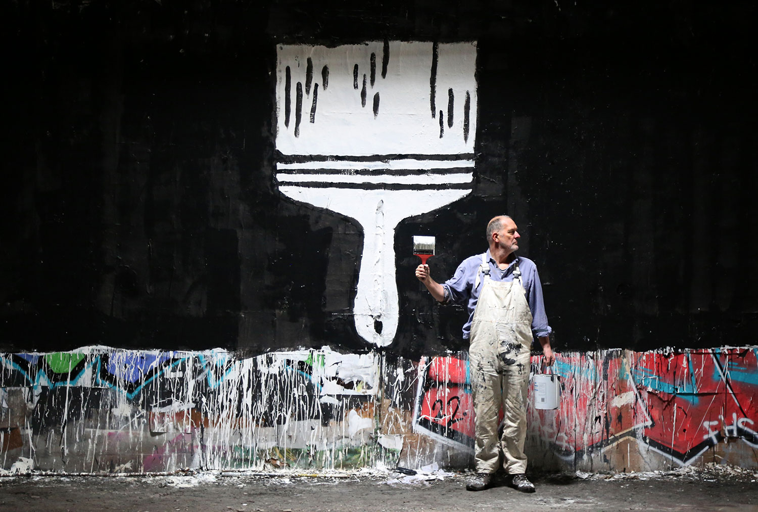 a local artist holding Brush after painting their portrait sometime in 2023